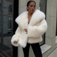 Cream vegan fur lapel jacket on a model with black trousers, option Cream, size L