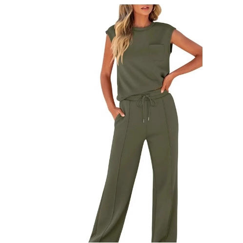 Angled view of the two-piece set with the sleeveless top tucked at the waist