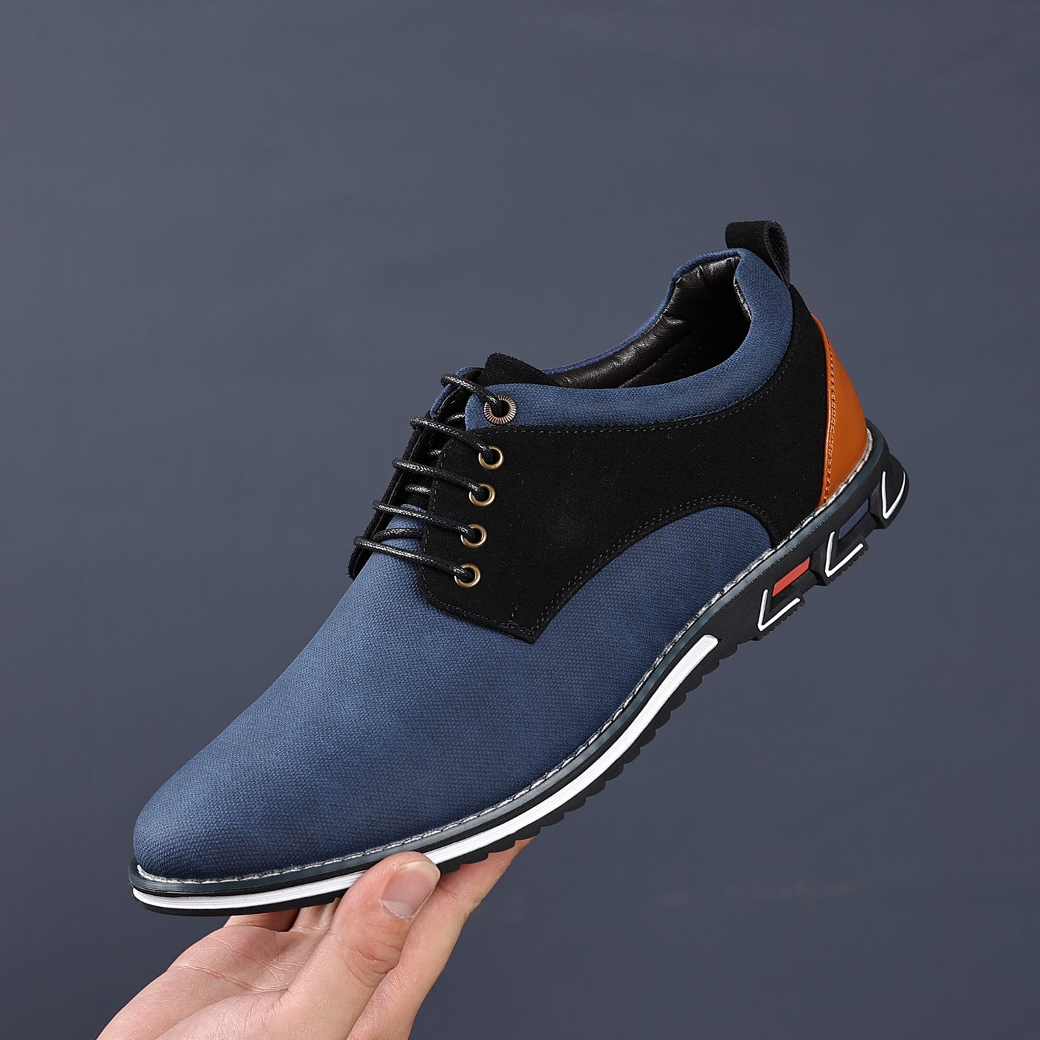Round toe derby shoe worn with rolled jeans for a smart casual look
