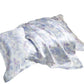 Two lilac and white watercolor print silk pillowcases on a white background, one folded over the other