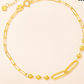 Bracelet held against a hand showing the delicate bead size and scale