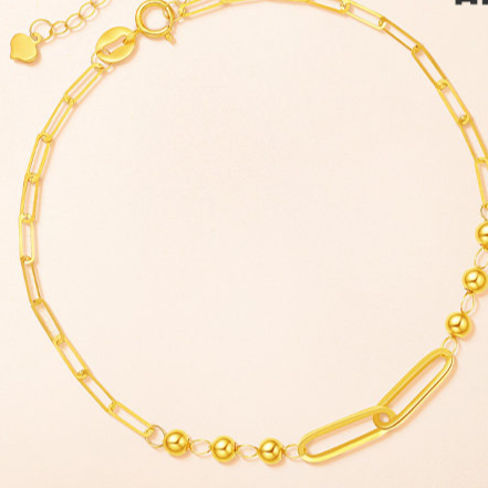 Bracelet held against a hand showing the delicate bead size and scale