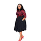 Red and black belted midi dress with printed bodice and black pleated swing skirt on a model