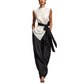Woman wearing the sleeveless top and wide-leg pants set in a lifestyle scene