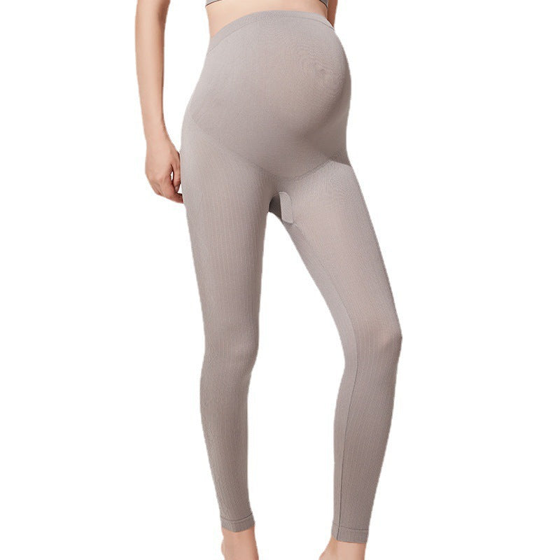 Grey maternity leggings shown from the front with the high waist panel over the bump