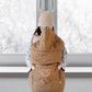 Fold up hood of the quilted baby cape shielding the head from the wind