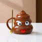 Brown poop emoji ceramic mug with heart eyes love face and pointed lid on a light background