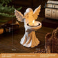 Angel tealight figure under soft studio lighting on a plain background