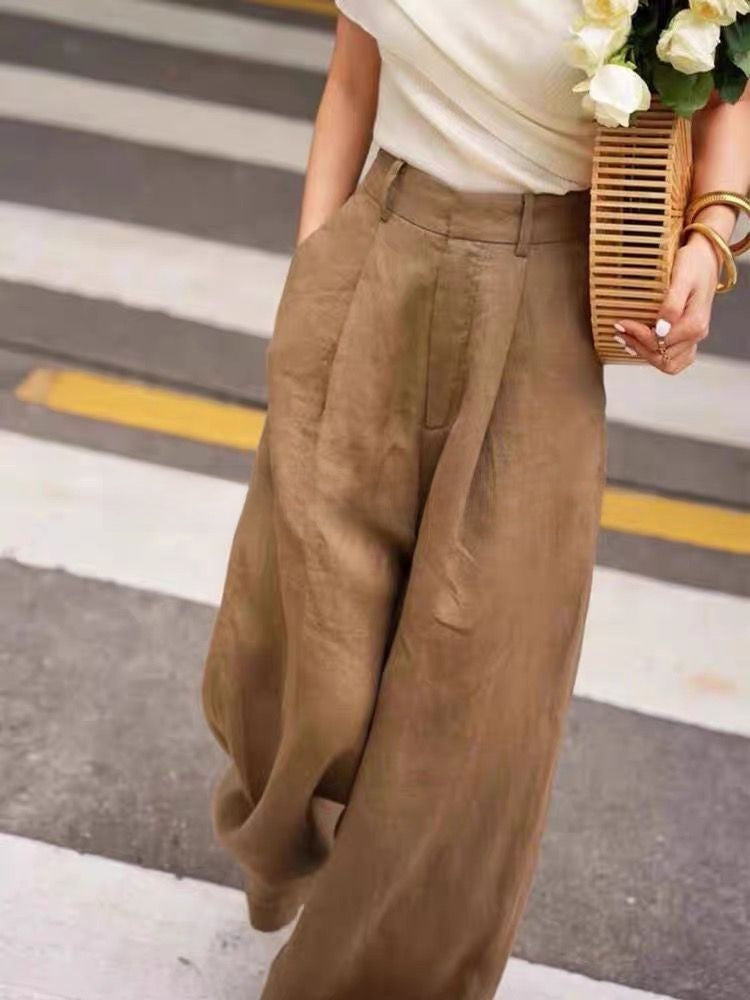 Side view of high waist cotton linen wide leg trousers falling in a full straight column