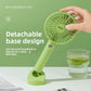 Handheld USB fan held in one hand pushing a breeze on a warm day