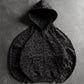 Charcoal leopard print zip-up hoodie with raglan sleeves and front pouch pocket, flat lay