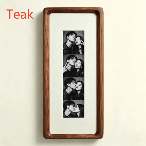 Teak photo strip frame with classic almond white lining and a tempered glass front on a cream wall