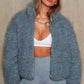 Camel teddy fleece jacket detail showing the plush curly surface