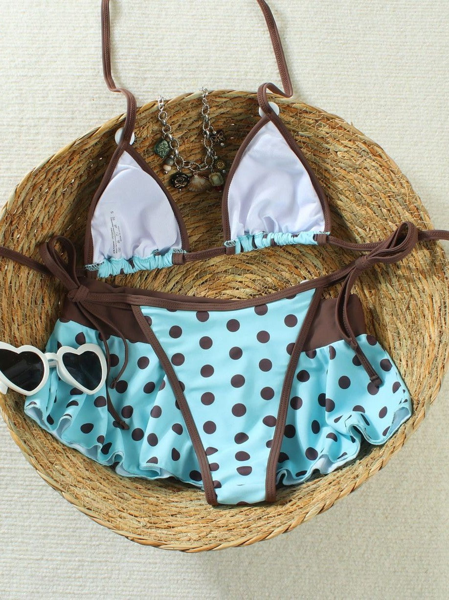 Bikini set flat lay turned over, white lining inside the triangle cups and the brown hip ties untied