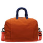 Travel duffel bag carried by the detachable crossbody strap on the shoulder