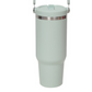 Light green insulated tumbler with a stainless steel ring below the flip lid and a handle at the top