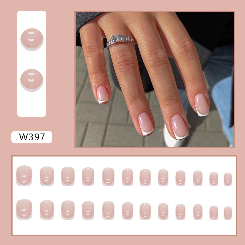 Full cover press-on almond nails in a soft pink, glossy finish shown on a hand
