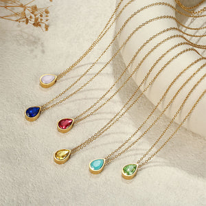 Six gold plated teardrop pendant necklaces with blue, pink, red, yellow and green stones