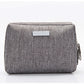 Travel toiletry bag with a divider and elastic loops keeping toiletries organised