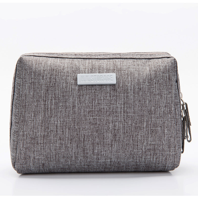 Travel toiletry bag with a divider and elastic loops keeping toiletries organised
