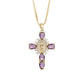 Paved cubic zirconia cross pendant necklace laid flat on a light background