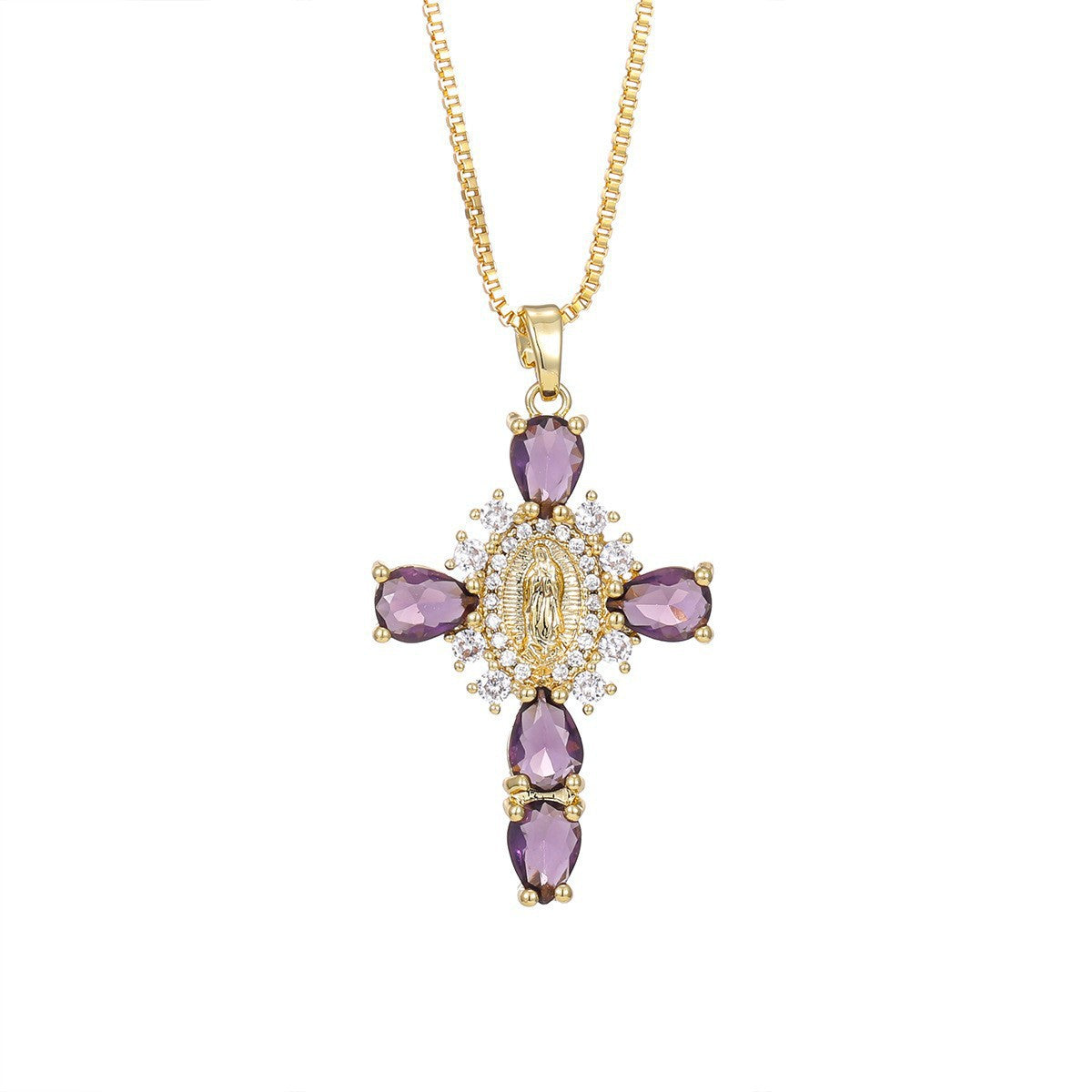 Paved cubic zirconia cross pendant necklace laid flat on a light background