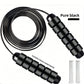 Plain black weighted skipping rope shown with its two removable metal bars