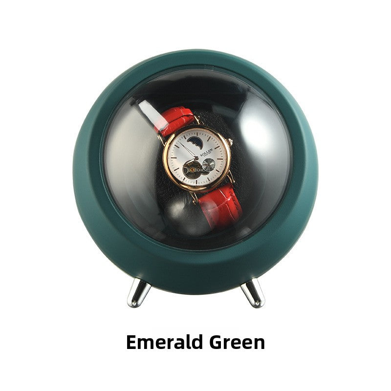 Emerald Green watch winder capsule on metal feet holding one watch behind the transparent dome