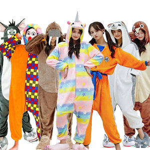 Second group shot of animal and character onesies with a rainbow unicorn, an orange outfit and a walrus