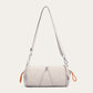 Grey cylindrical nylon crossbody bag with stitched front lines and orange cord loops, variant image for the grey color
