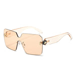 Rimless shield sunglasses with a one piece squared lens and enamelled snake head hinges