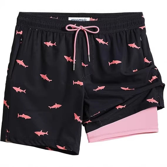 Black men's swim trunks with pink shark print and inner liner shown