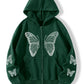 Butterfly zip hoodie paired with everyday items in a relaxed setting