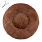 Dark brown round plush pet bed with a raised bolster rim on a plain background