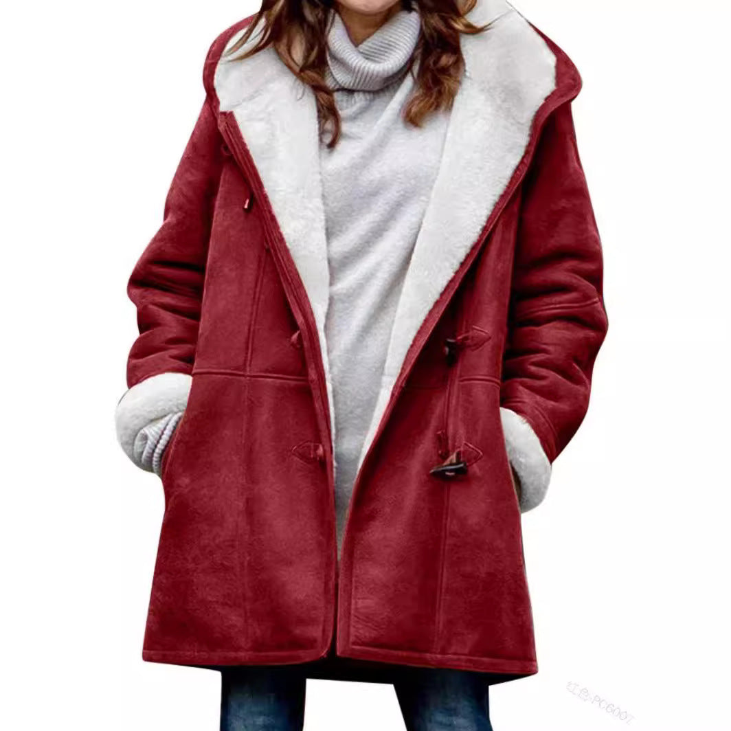 Model in an open red hooded toggle coat showing the white plush lining, cuffs and side pockets