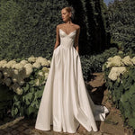 Strapless white satin A line wedding gown with a sweetheart neckline on a model