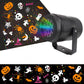 Black LED projector lamp angled on a stand projecting Halloween ghosts and pumpkin shapes
