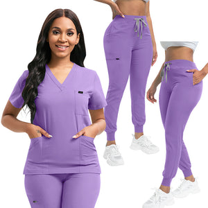 Unisex medical scrub set with a V neck short sleeve top and jogger pants on a model