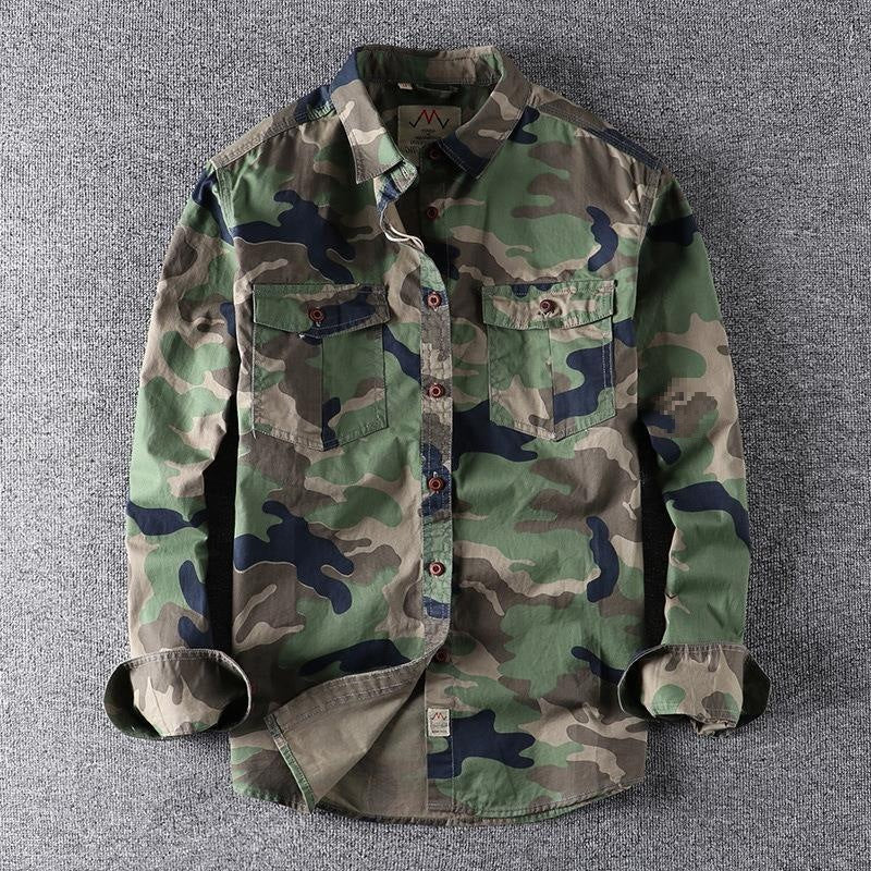 Men's washed camouflage long sleeve button shirt with two flap chest pockets laid flat with the sleeves rolled