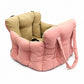 Padded car seat pet bed with raised bolster walls, carry handles and an inner clip empty on a car seat showing the raised b