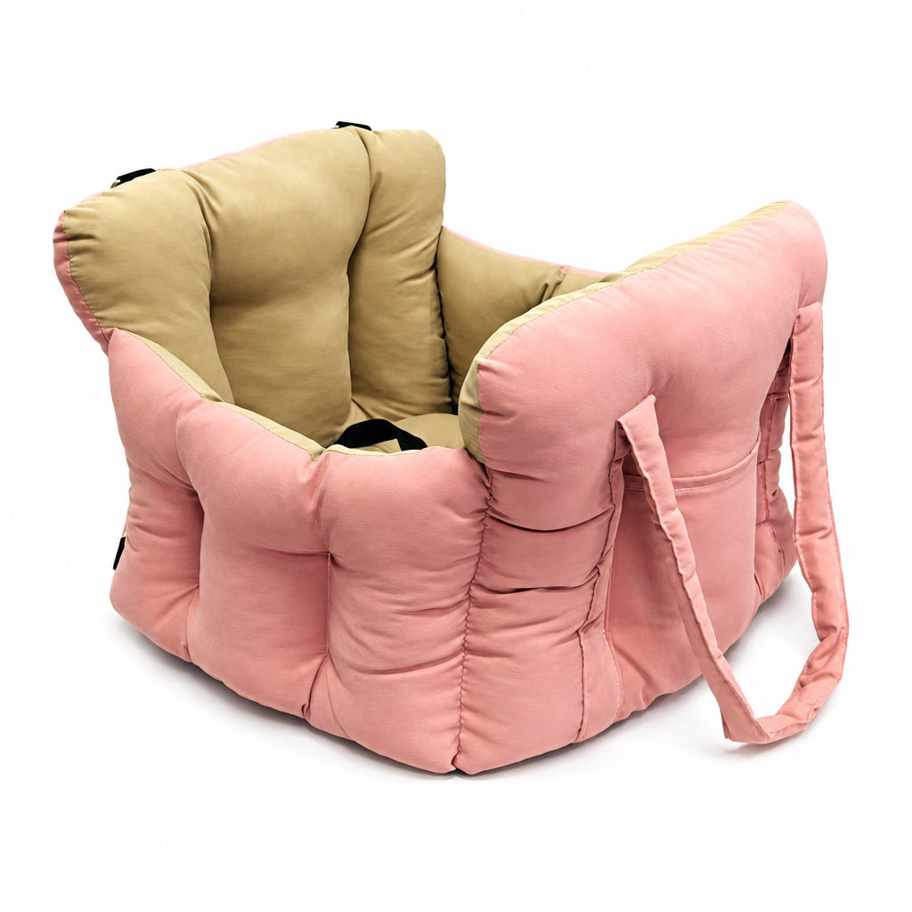 Padded car seat pet bed with raised bolster walls, carry handles and an inner clip empty on a car seat showing the raised b