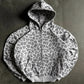 Light grey leopard print zip-up hoodie with front pouch pocket, flat lay