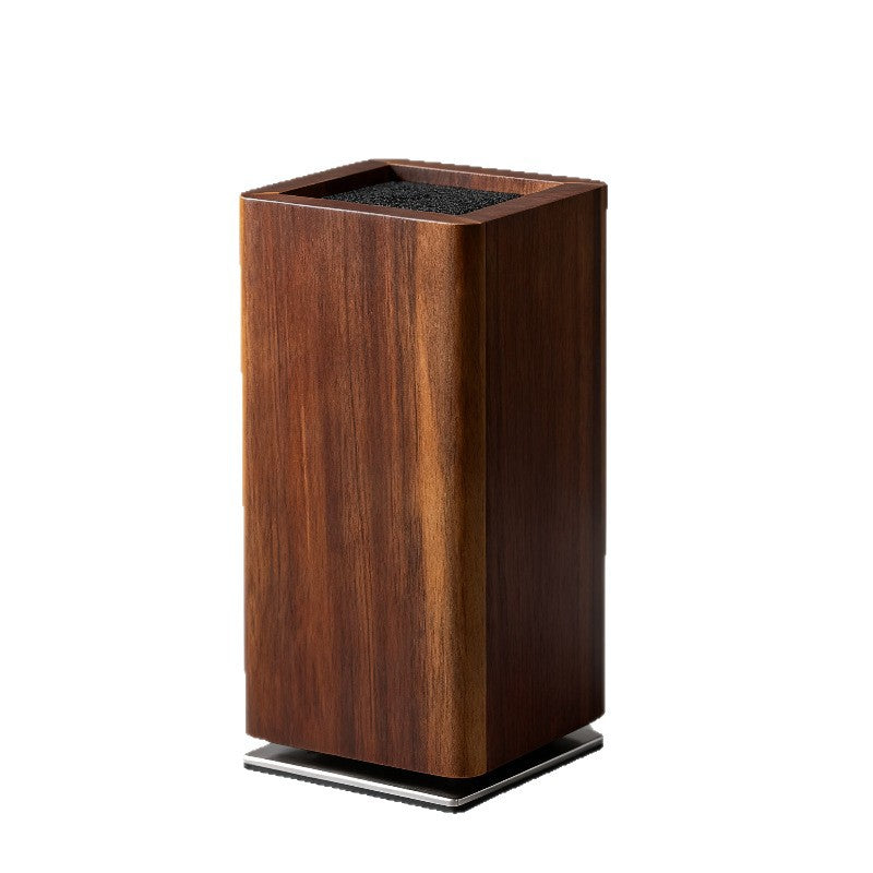 Angled acacia knife block showing bristle top and brushed steel rotating base plate