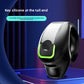 Black clip-on earphone with a green light rim on a purple stage, silicone tip at the back