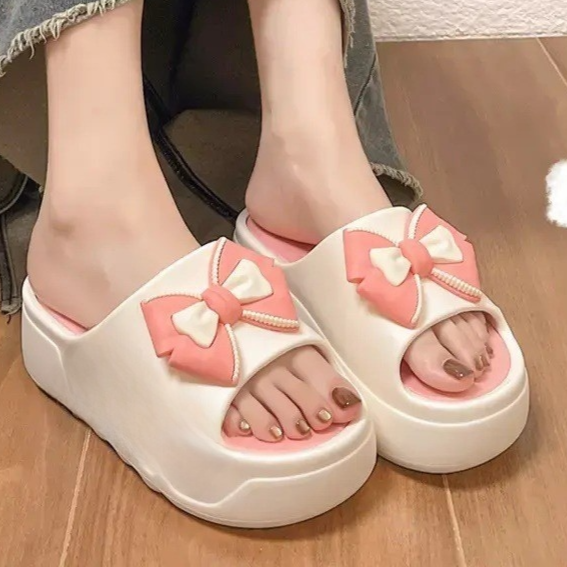 Womens platform slides, white bow platform slide worn
