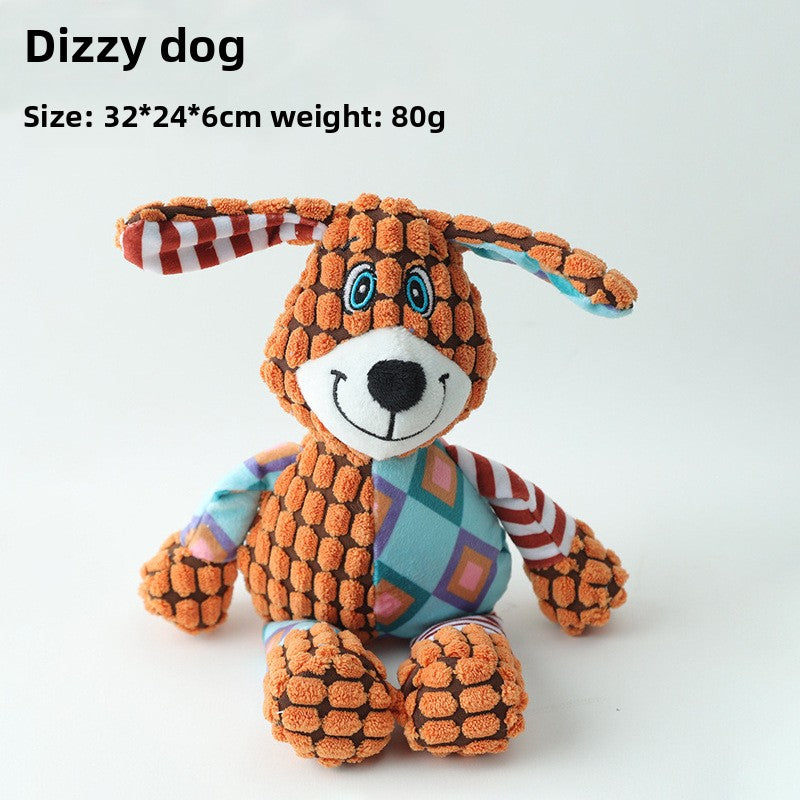 Patchwork corn velvet plush squeaky dog toy shaped like a floppy eared dizzy dog on a white background