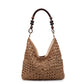 Blue and white open-weave hobo bag with a light beaded handle shown front on a white studio background