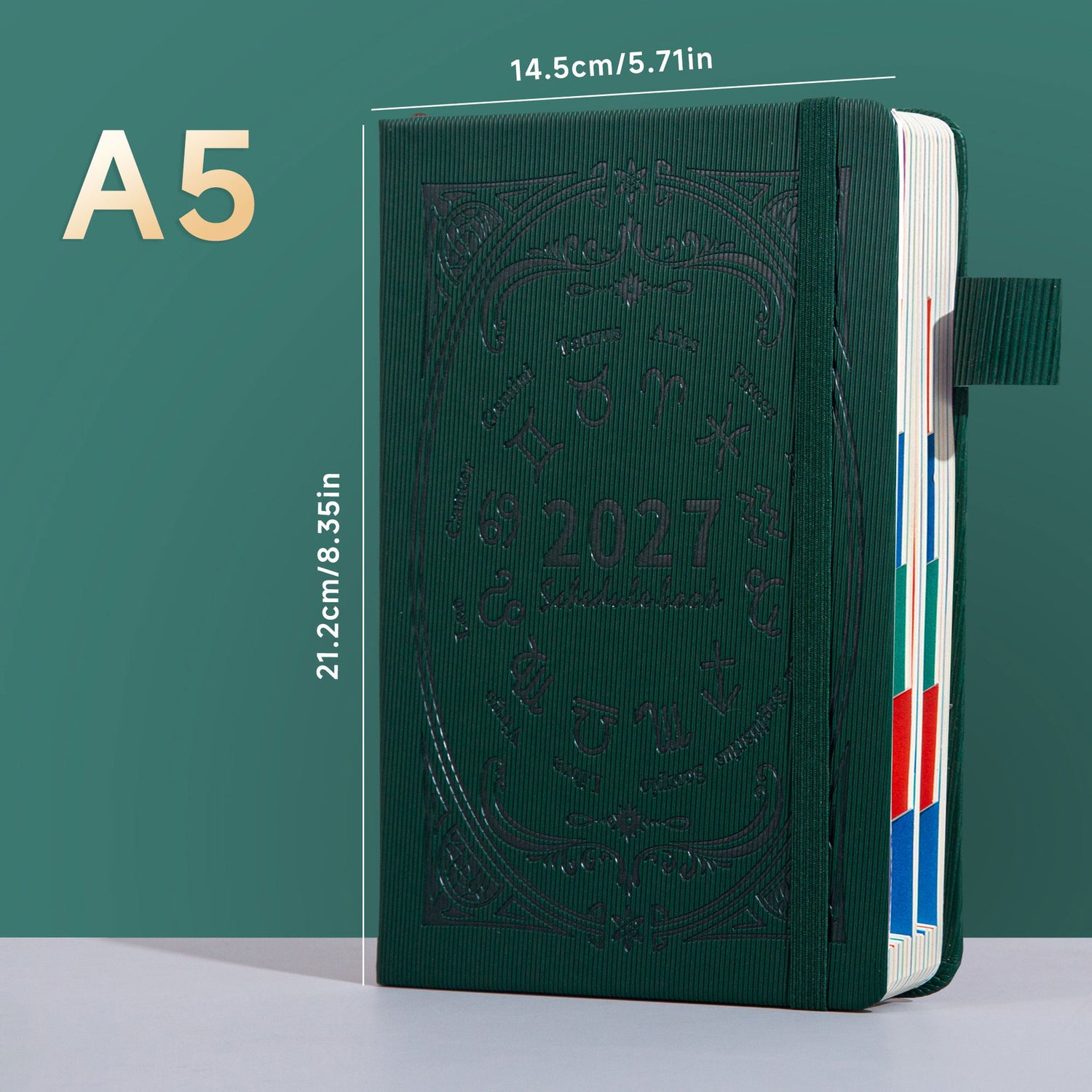 Green A5 zodiac embossed planner notebook shown upright with elastic band and pen loop