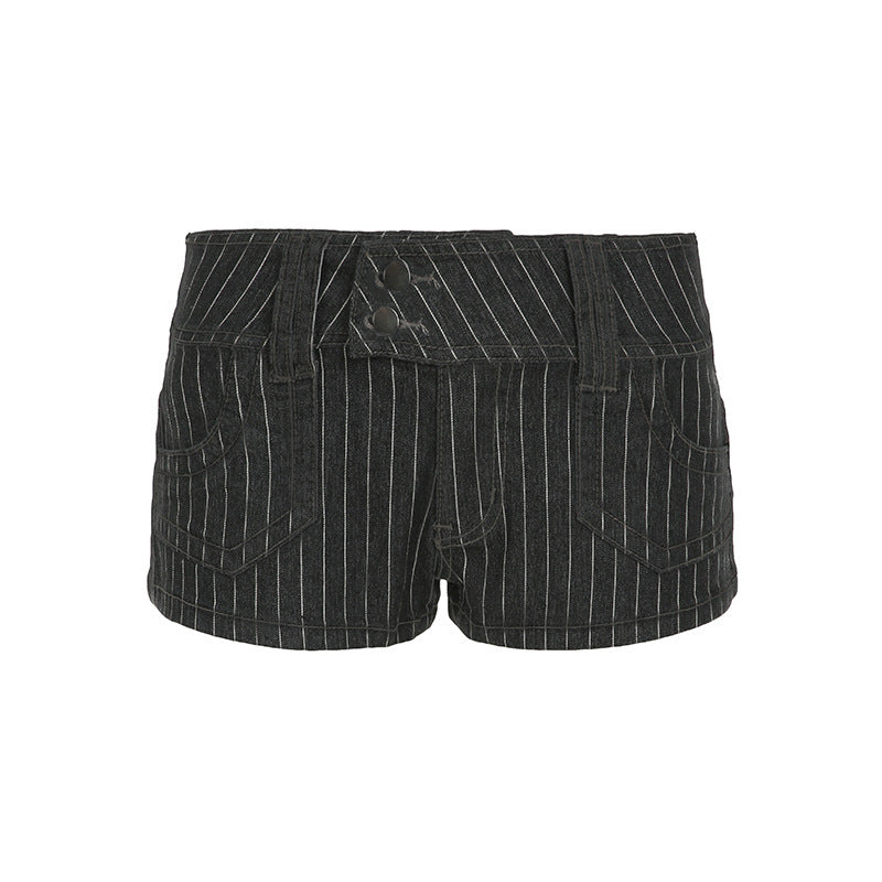 Flat lay of the low rise pinstripe denim shorts on a plain white background
