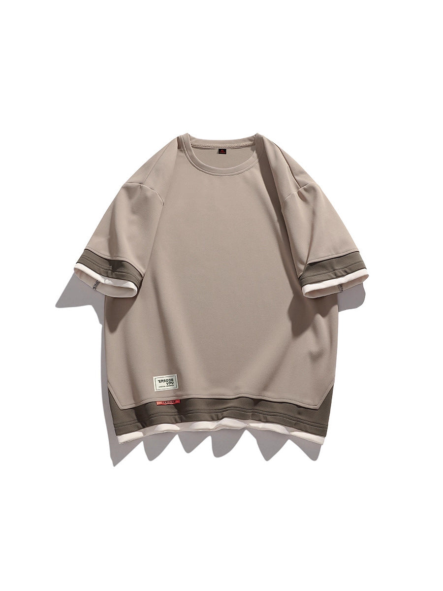 Men's short sleeve tee laid flat showing the straight cut and hem